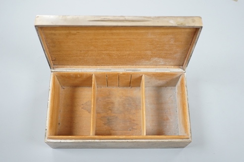 A George V silver mounted rectangular cigarette box, by Goldsmiths &Silversmiths Co. Ltd, London, 1910, the cover with 'cut out' hunting scene, 16.5cm.